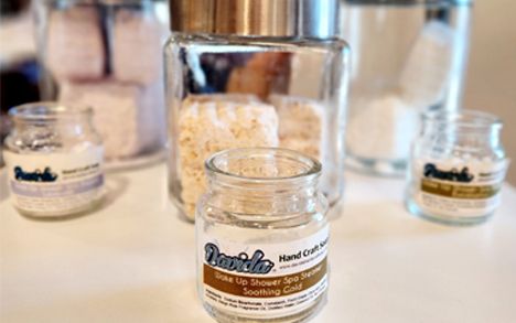Jars of Davida scrubs and shower steamers on display
